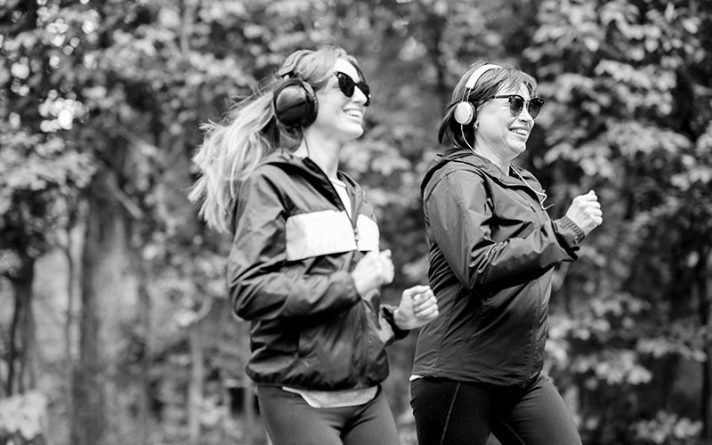 Two women running in the park
